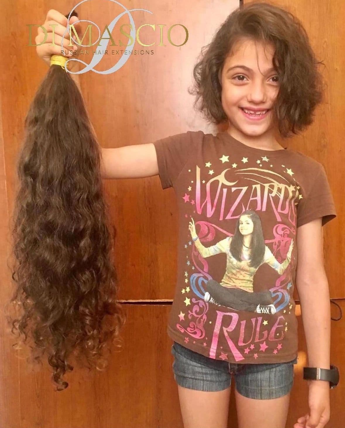 A girl holding a pony tail